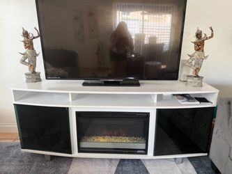 Tv console and fireplace