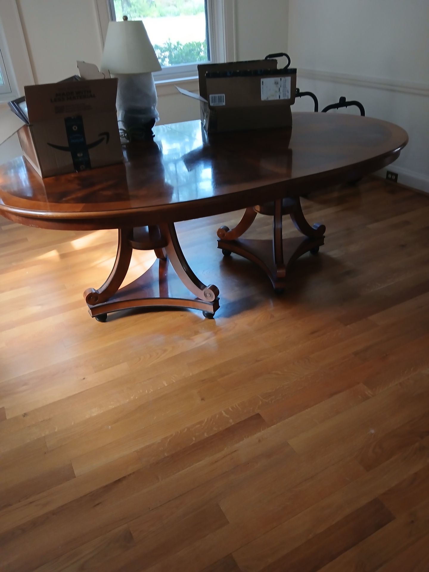 NICE WOOD TABLE NO CHAIRS HAS A 2 REMOVABLE LEAFS TO MAKE TABLE LONGER