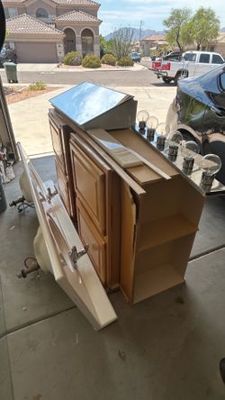 FREE bathroom vanity cabinets, counter with 2 sinks, 2 faucets, light, 72 x 43 mirror and mirror medicine cabinet. You pick up and haul.