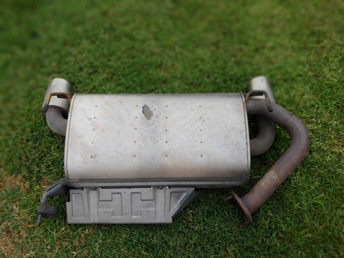 Nissan 350Z OEM muffler with chrome tips and a Borla resonator
