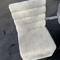 Tan/beige Chairs it has wheels