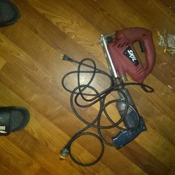 Electric Skill Saw And Electric Drill 