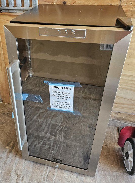 STAINLESS STEEL FREESTANDING WINE COOLER......28 BOTTLES......17 INCHES.....NEW...$ 250