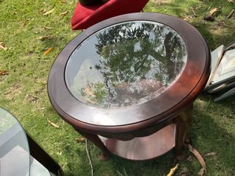 Round glass top wooden table