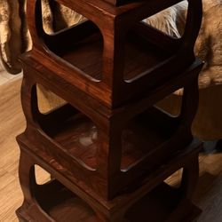 A Table and Collapsible Tower In Brown 