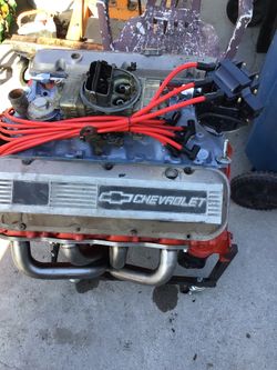 454 Chevy engine new distributor,new headers,new wires, holly carberator double pumper,new engine stand,and some wire accessories