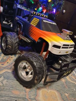 Toy truck lifted with big wheels