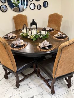 Big Table , beautiful , dining set with 6 leather  chairs, the table measures W 71 X H 31 1/2