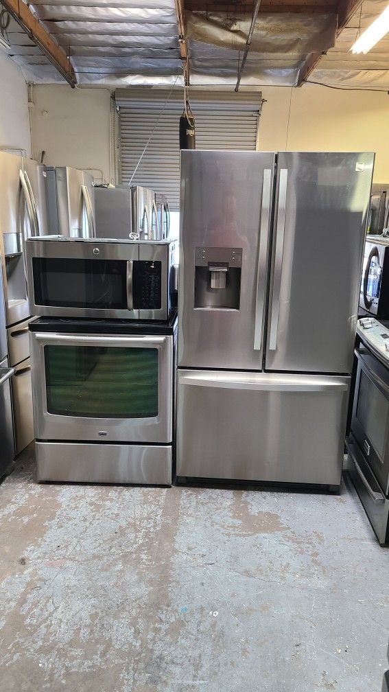 Refrigerator Kenmore French Door, Stove Electric And Microwave In Stainless Steel Combo Delevery