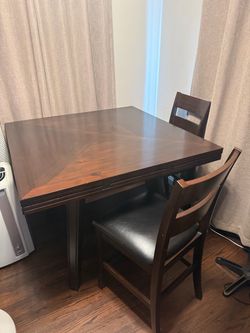 Solid dark brown wood dinner table w/ leaf