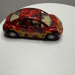 This is a collectible model toy car: a Kinsmart Volkswagen New Beetle.