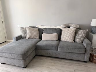 We are moving and unfortunately don’t have the space for this beautiful gray reversible sectional sofa!
