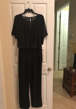 Calvin Klein jumpsuit size 12 never been worn, brand new with tags! Originally 129.00