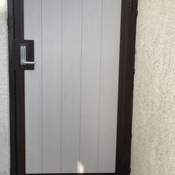 Metal gate with key pad lock