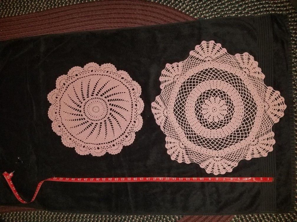 Multiple vintage hand-made doilies