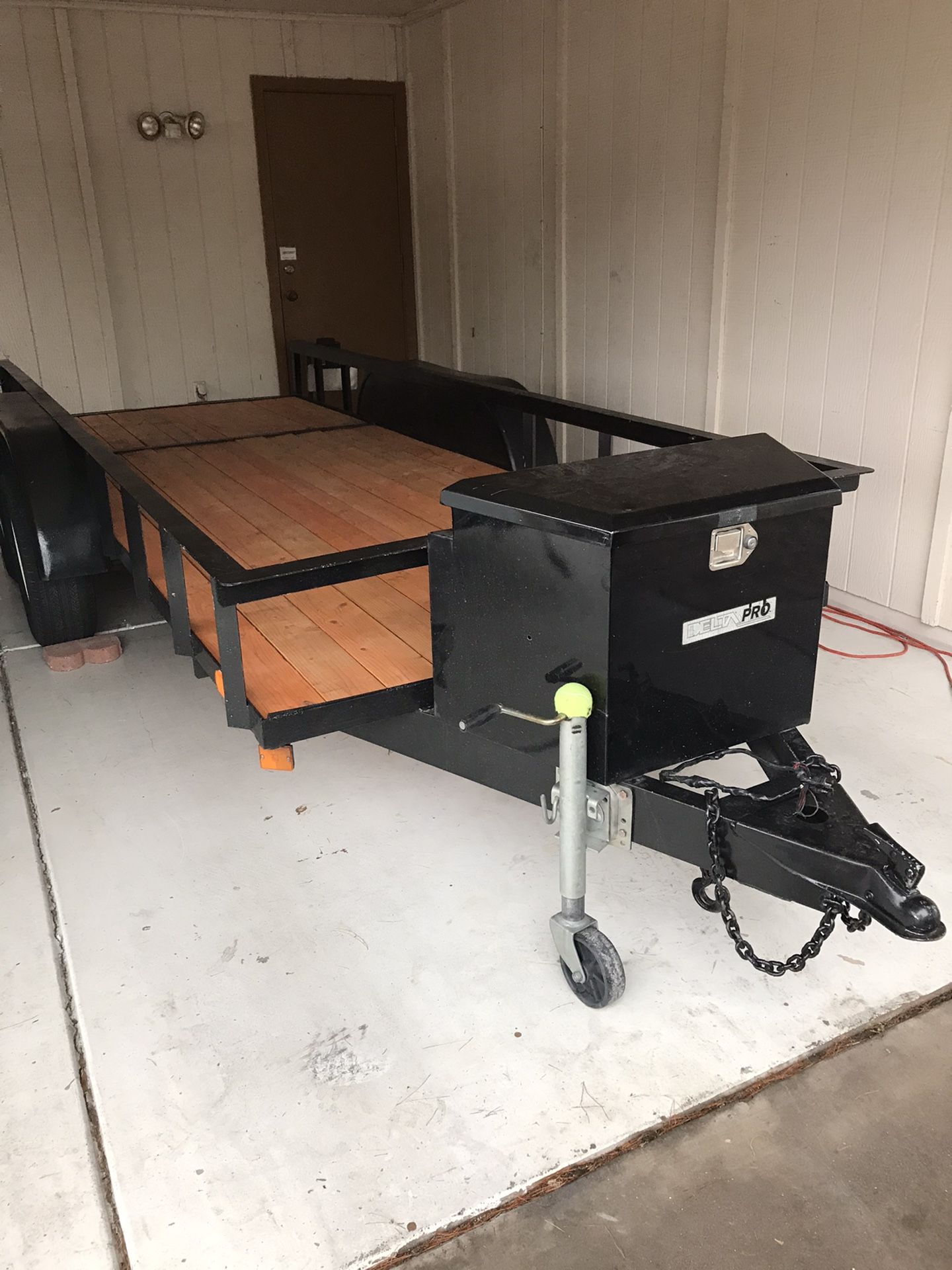 5’ X 14’ Dual axle utility trailer with a delta pro storage box and key