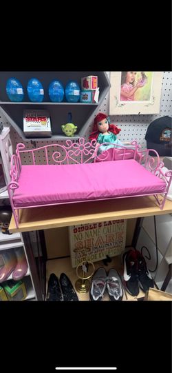 Pink doll bed