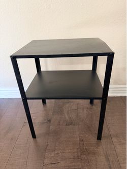 Black metal bedside table