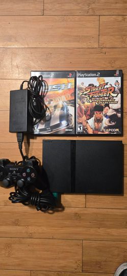 Playstation 2 slim and 2 games