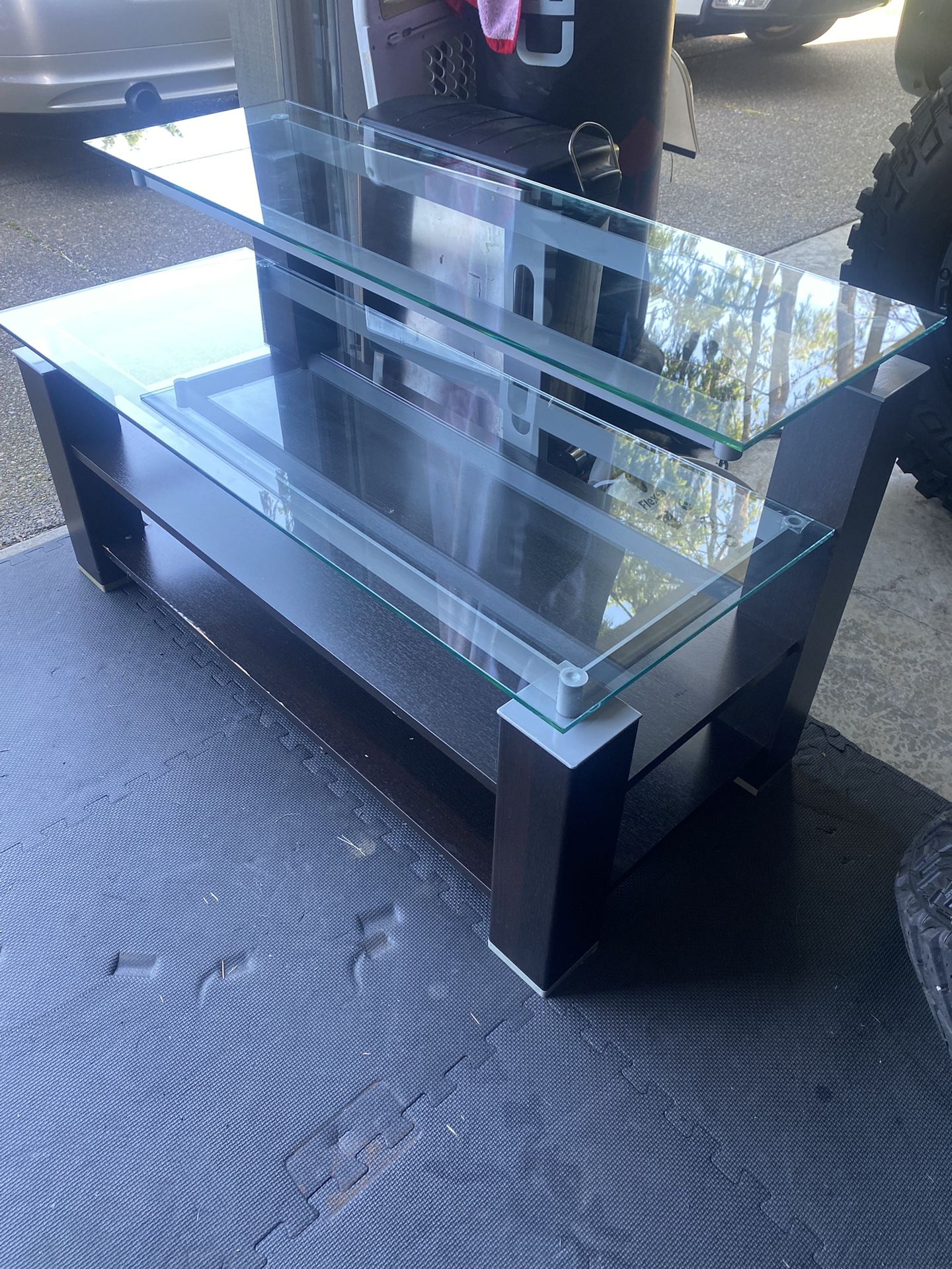 TV stand 45” Wide 20” Deep. Glass I Perfect Shape, Wood Need Just Couple Small Touch Ups. Had 65” TV On It, So Would Be Fine With Most Any Size TV.