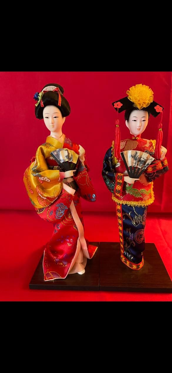 A pair of Japanese and Chinese Dolls