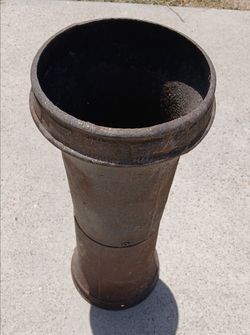 Tall Iron Cast.  Size is 22 inches tall and 7.5 inches wide.  Could be used to hold pots and planters.   $10