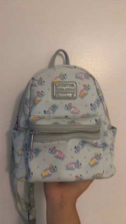 Disney Parks Loungefly Dumbo mini backpack featuring a light blue all-over print of the flying elephant ride.