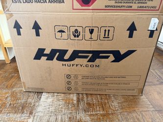Huffy electric motorcycle with training wheels