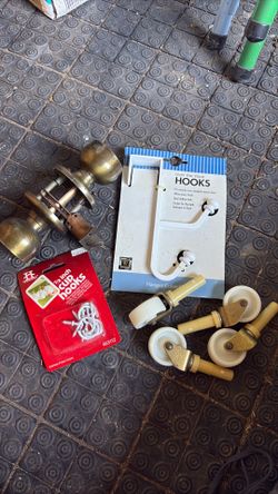 2 Boxes full of door knobs, hooks, rollers, handles, door hardware.