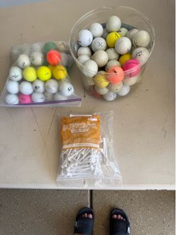 Assorted golf balls and tees
