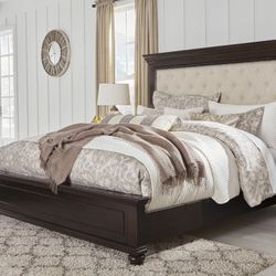 Brynhurst Dark Brown King Upholstered Panel Bed

