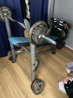 Weight Bench with Barbell and Plates