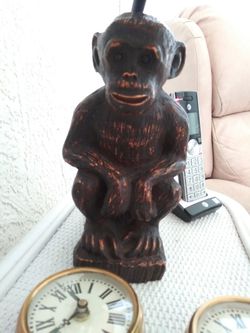 Vintage cast iron monkey lamp with rawhide lamp shade