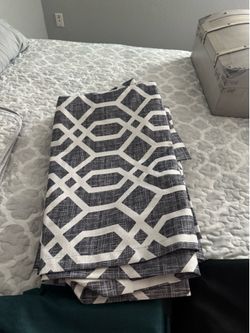 For white and gray lined curtain panels