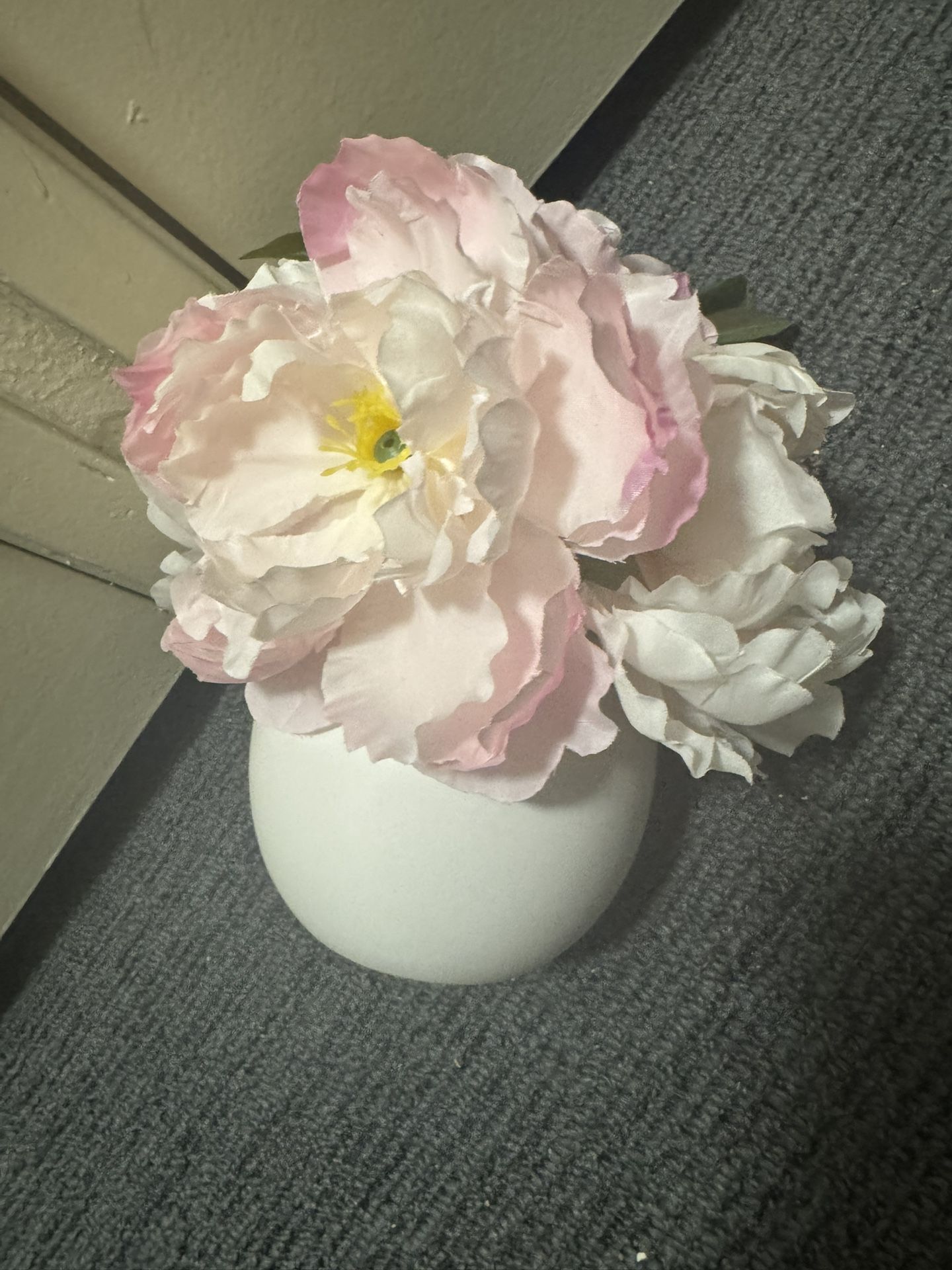Fake flowers in ceramic pot