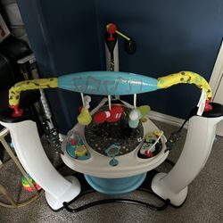 Evenflo ExerSaucer Jump and Learn Jam Session Activity Station Jumper for Babies