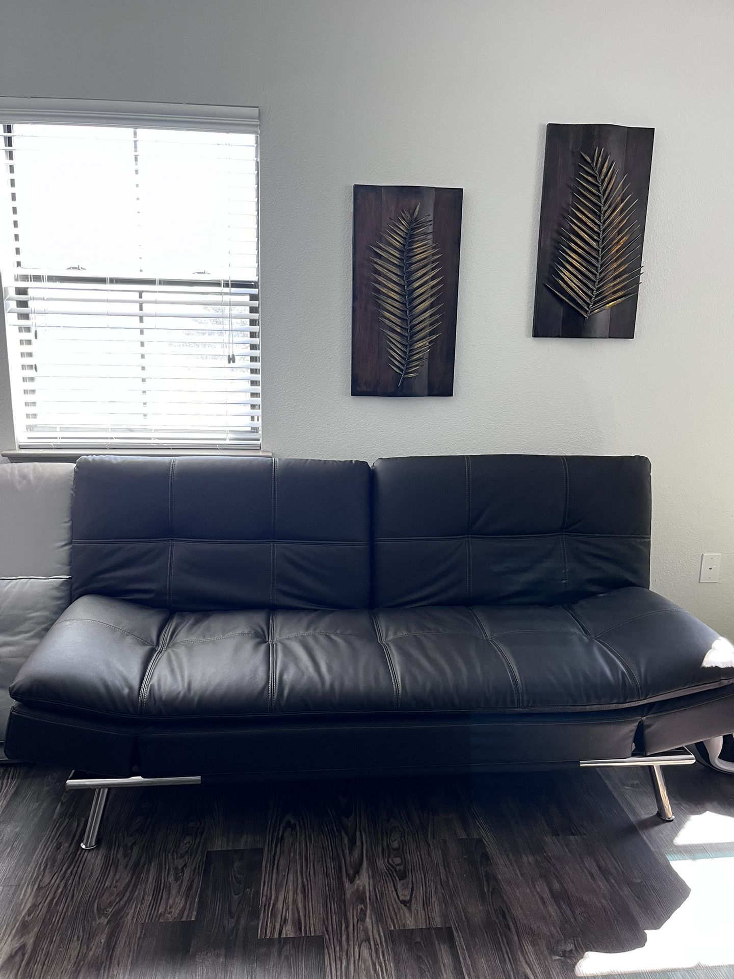 Leather Euro Lounger And Metal Wall Art
