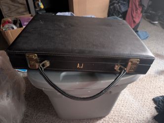 1960s Black leather briefcase with retro psychedelic liner, and diagonal zipper pocket