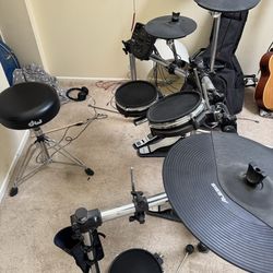 Alesia electric drum set and speaker