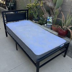 Twin Mattress with bed frame.    $50 Or Best Offer 