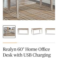 Realyn 60" home office desk with USB charging and hideaway keyboard drawer.
From Ashley Furniture