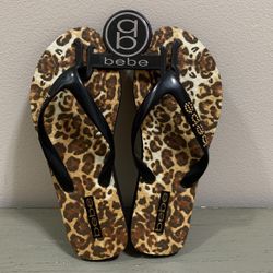 Bebe Leopard Print Flip Flops - size small