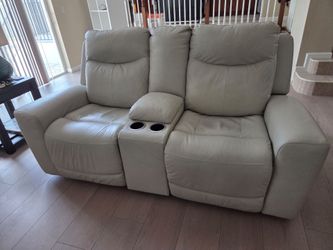 Ashley Mindanao Dual Power Coconut Leather Reclining Loveseat with Console

Bought in 2025