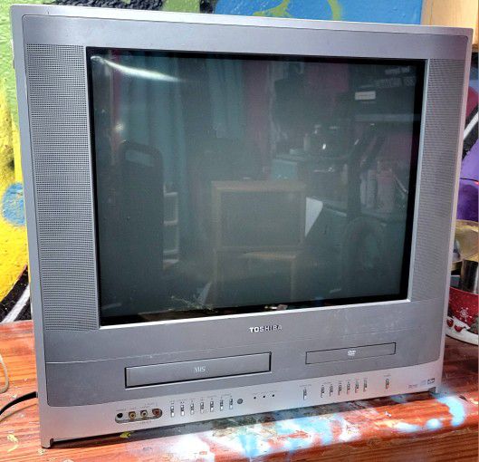 Vintage Toshiba TV television with VHS and DVD player and Lot of Classic VHS tapes