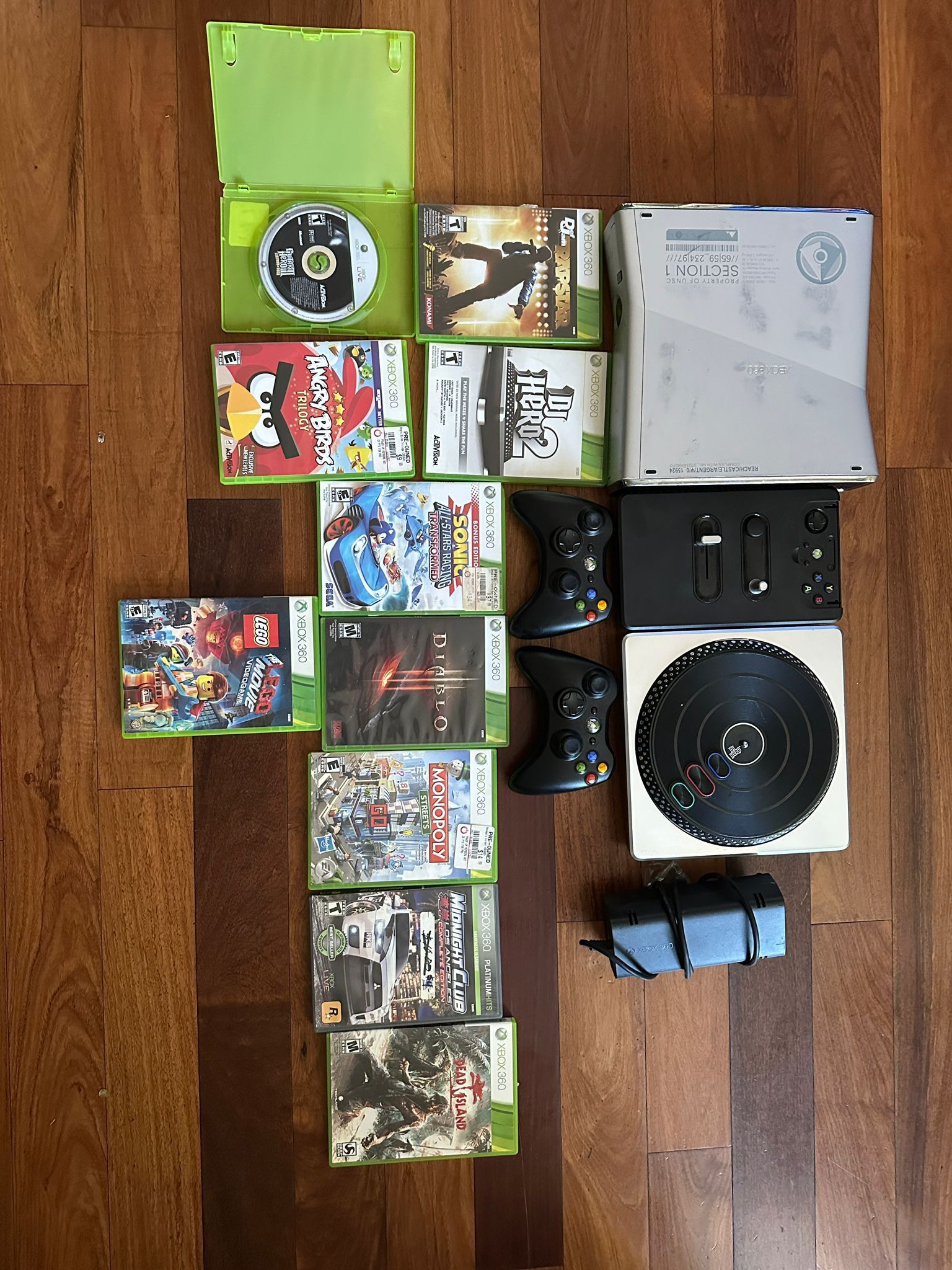 Xbox console and 2 controllers with DJ Hero and 10 games included