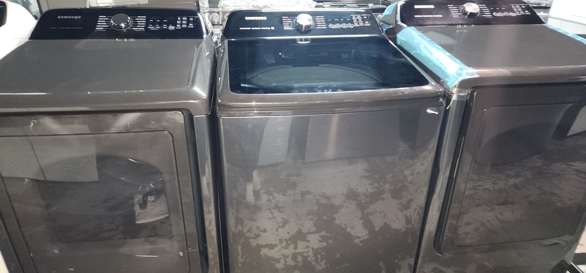 Samsung 5.4 Cu. Ft. Washer and 7.4 Cu. Ft. Electric Dryer in Black.