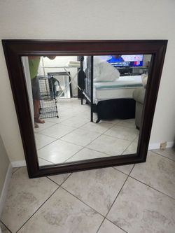 48 in by 48-in hanging wall mirror with a 4-in wood trim $27.50-- Firm