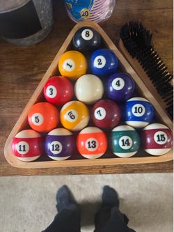 Pool balls and brush