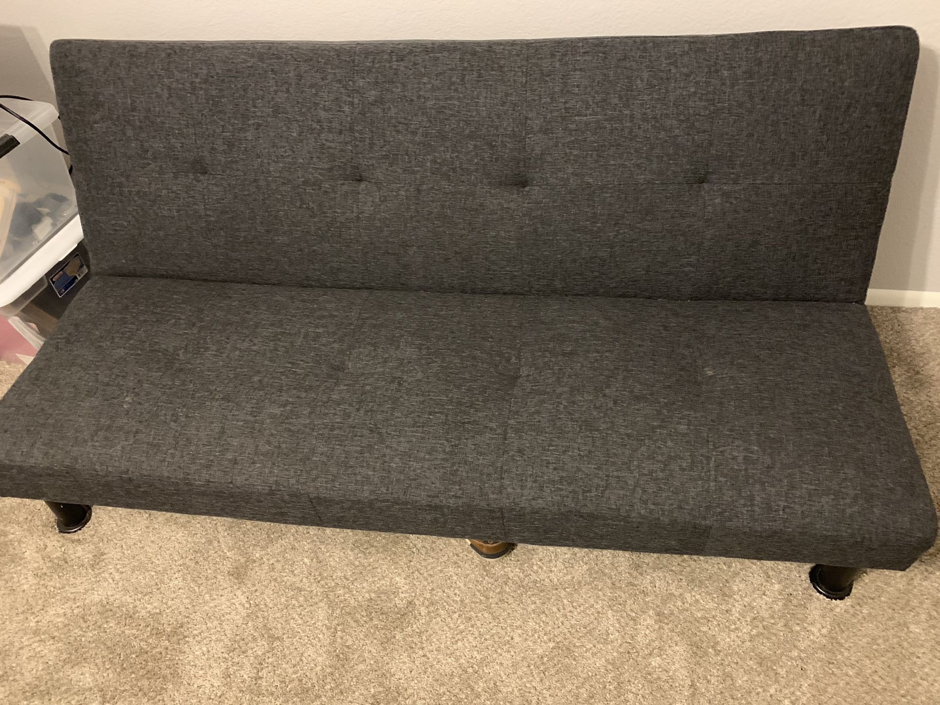 Dark charcoal grey futon. Convertible to a bed Rarely used for Sale in