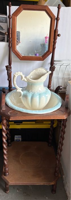 Victorian-style wooden washstand complete with matching ceramic pitcher and basin set